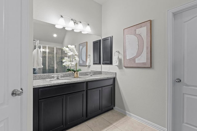 19825 Rhiannon Ln, Pflugerville, TX 78660 - bathroom featuring tile patterned floors, double vanity, and a stall shower