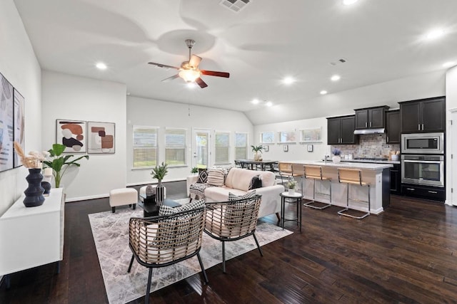 19825 Rhiannon Ln, Pflugerville, TX 78660 - living area featuring dark wood-style flooring, ceiling fan, recessed lighting, and vaulted ceiling
