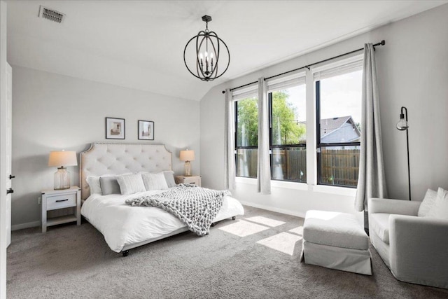 8309 Spire Vw, Austin, TX 78744 - carpeted bedroom featuring a chandelier and lofted ceiling