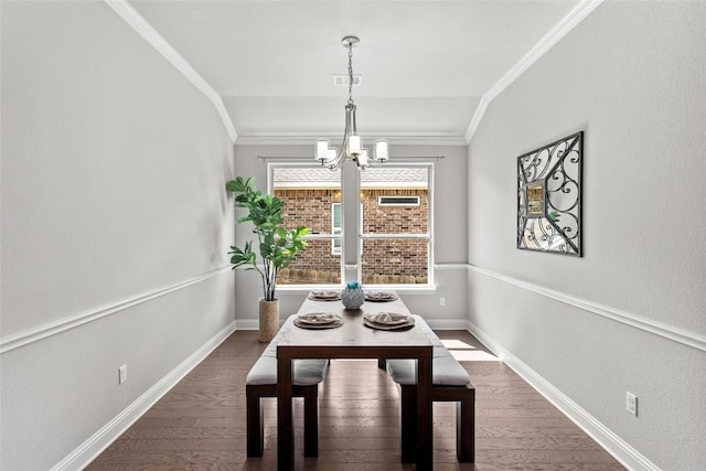 226 Brentwood Dr, Austin, TX 78737 - dining room with a chandelier, dark wood finished floors, and crown molding