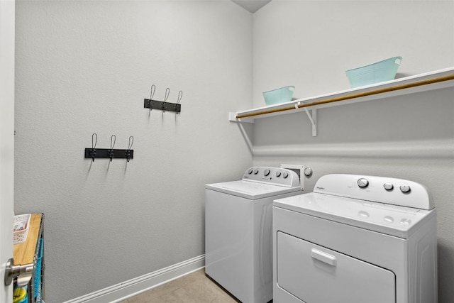 226 Brentwood Dr, Austin, TX 78737 - washroom featuring separate washer and dryer and light tile patterned floors