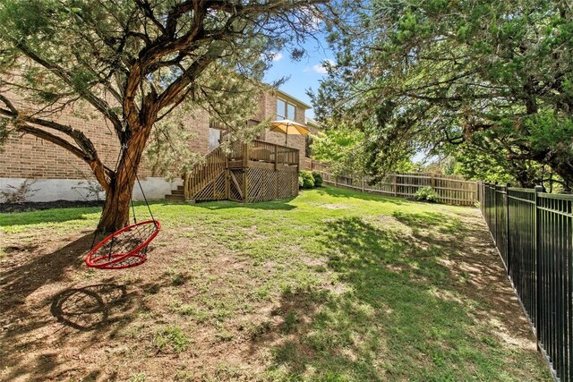 226 Brentwood Dr, Austin, TX 78737 - fenced backyard with stairs and a wooden deck