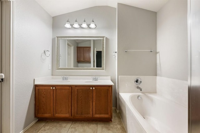 1704 Big Bend Dr, Cedar Park, TX 78613 - bathroom featuring double vanity, a garden tub, tile patterned floors, and lofted ceiling