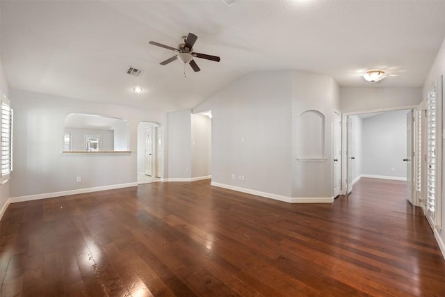 1704 Big Bend Dr, Cedar Park, TX 78613 - unfurnished living room with ceiling fan, dark wood-style flooring, vaulted ceiling, arched walkways, and plenty of natural light