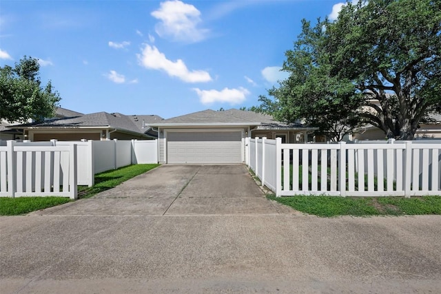 1704 Big Bend Dr, Cedar Park, TX 78613 - view of front of house with a garage, driveway, and a fenced front yard