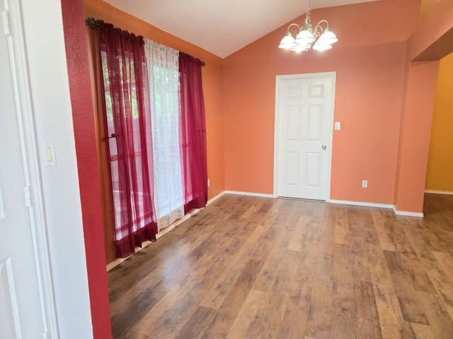 211 Valley Run Trl, Elgin, TX 78621 - entryway with wood-type flooring, a chandelier, vaulted ceiling, and plenty of natural light