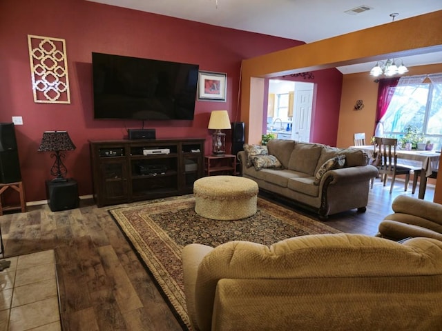 211 Valley Run Trl, Elgin, TX 78621 - living area with a chandelier and wood-type flooring