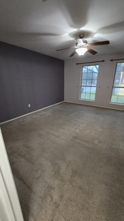 211 Valley Run Trl, Elgin, TX 78621 - carpeted spare room with ceiling fan and baseboards
