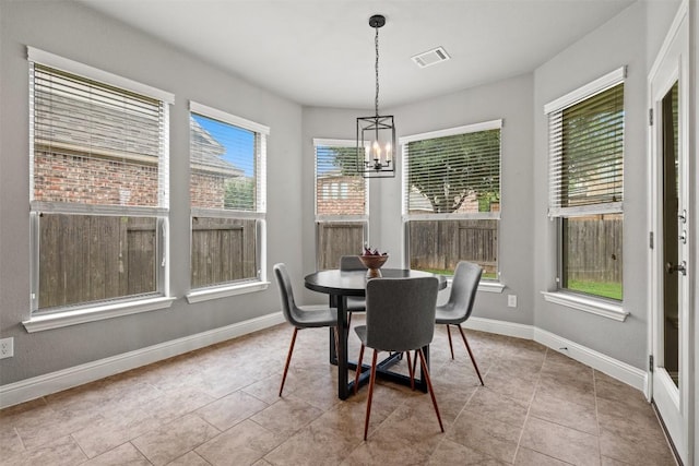 3041 Agave Loop, Round Rock, TX 78681 - tiled dining space featuring a chandelier and baseboards
