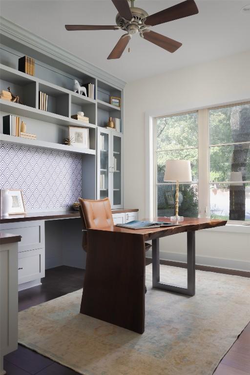 4001 Firstview Dr, Austin, TX 78731 - office area featuring ceiling fan, built in desk, and dark wood-style flooring