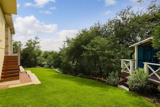 4001 Firstview Dr, Austin, TX 78731 - view of green lawn with stairway and a wooden deck