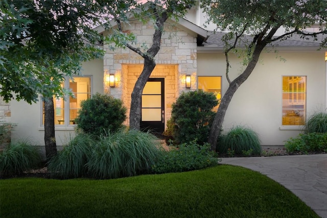 4001 Firstview Dr, Austin, TX 78731 - view of front of property with stone siding, stucco siding, and a front yard