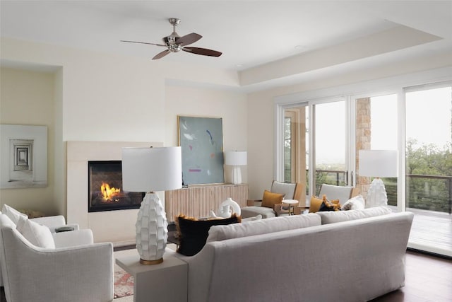 4001 Firstview Dr, Austin, TX 78731 - living room with a multi sided fireplace, ceiling fan, radiator heating unit, and wood finished floors
