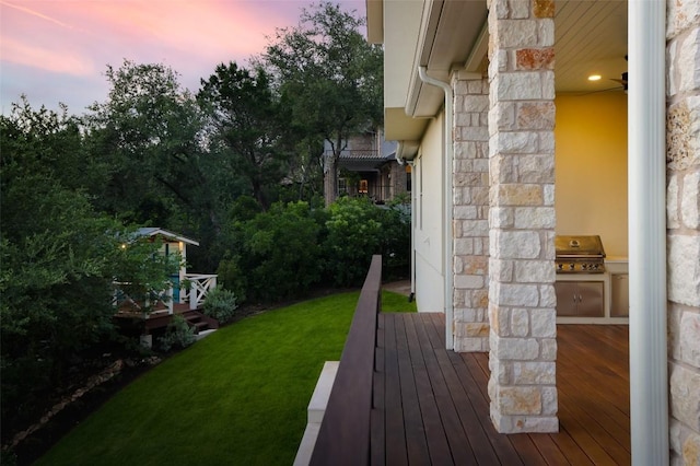 4001 Firstview Dr, Austin, TX 78731 - view of grassy yard featuring a wooden deck and exterior kitchen
