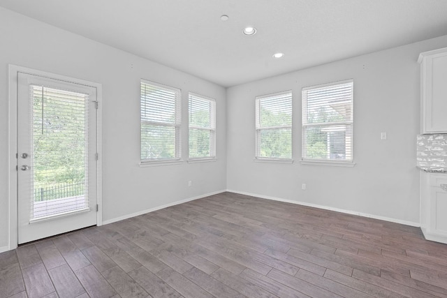 2800 Joe Dimaggio Blvd Unit 84, Round Rock, TX 78665 - unfurnished dining area featuring plenty of natural light, wood finished floors, and recessed lighting
