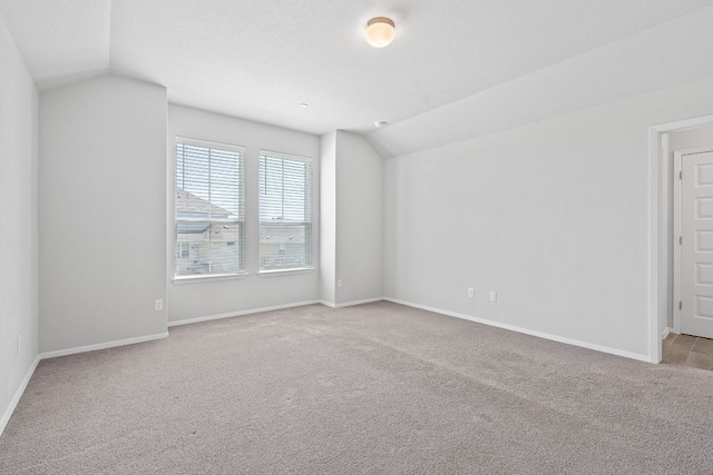 2800 Joe Dimaggio Blvd Unit 84, Round Rock, TX 78665 - spare room featuring lofted ceiling and carpet floors