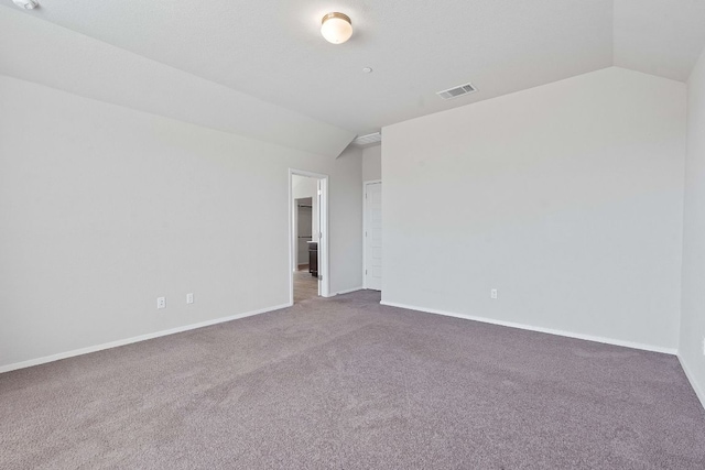 2800 Joe Dimaggio Blvd Unit 84, Round Rock, TX 78665 - spare room featuring vaulted ceiling and carpet floors