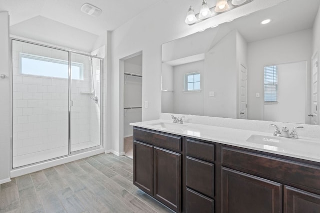 2800 Joe Dimaggio Blvd Unit 84, Round Rock, TX 78665 - full bath with a shower stall, double vanity, a spacious closet, and wood finished floors