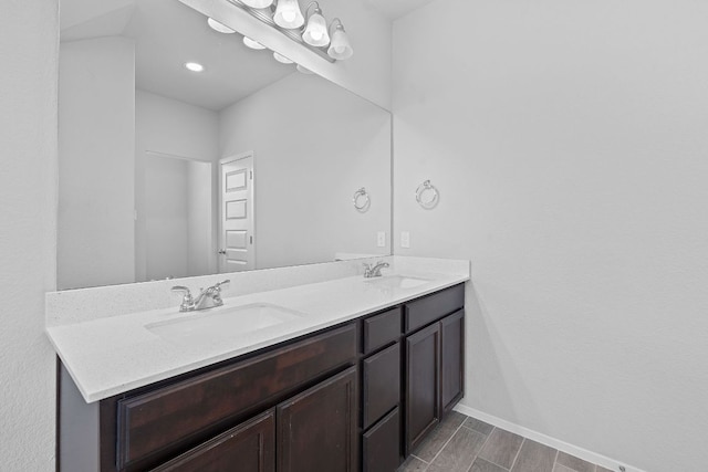 2800 Joe Dimaggio Blvd Unit 84, Round Rock, TX 78665 - full bathroom with double vanity and baseboards