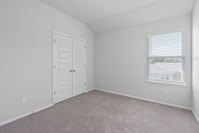 2800 Joe Dimaggio Blvd Unit 84, Round Rock, TX 78665 - unfurnished bedroom with carpet floors, vaulted ceiling, and a closet