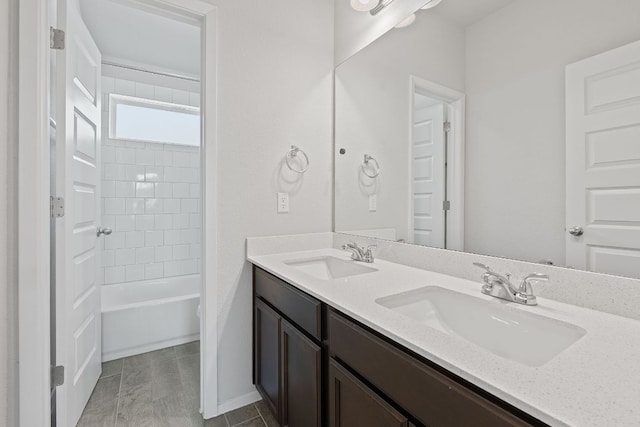 2800 Joe Dimaggio Blvd Unit 84, Round Rock, TX 78665 - bathroom featuring double vanity and bathing tub / shower combination