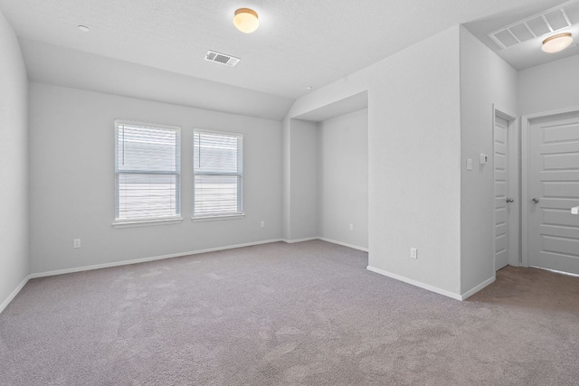 2800 Joe Dimaggio Blvd Unit 84, Round Rock, TX 78665 - carpeted spare room featuring baseboards and lofted ceiling