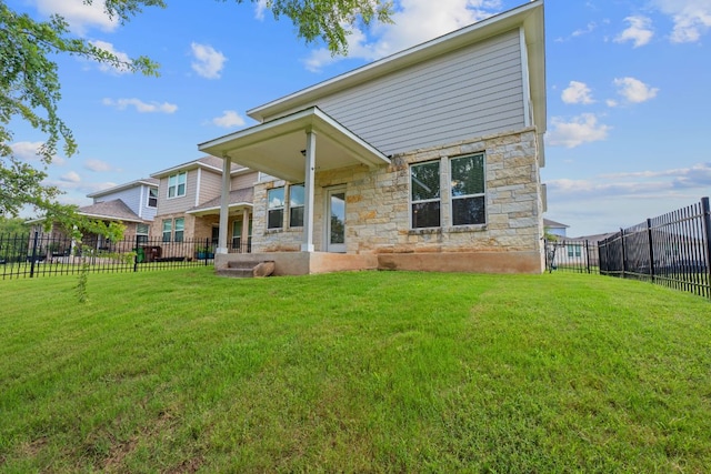 2800 Joe Dimaggio Blvd Unit 84, Round Rock, TX 78665 - rear view of house featuring stone siding and a fenced backyard