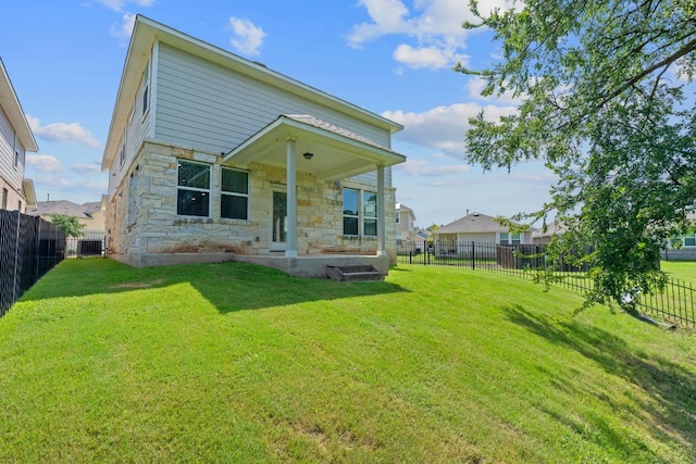 2800 Joe Dimaggio Blvd Unit 84, Round Rock, TX 78665 - rear view of property with stone siding and a fenced backyard