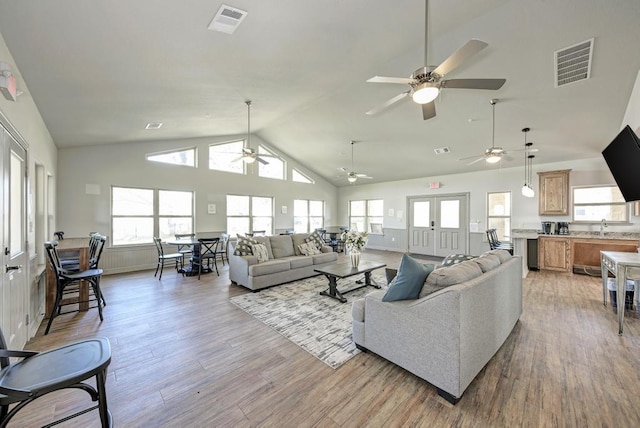 2800 Joe Dimaggio Blvd Unit 84, Round Rock, TX 78665 - living room featuring a ceiling fan, healthy amount of natural light, light wood-type flooring, and high vaulted ceiling