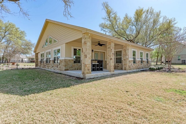 2800 Joe Dimaggio Blvd Unit 84, Round Rock, TX 78665 - back of property with ceiling fan, stone siding, a patio, and a yard