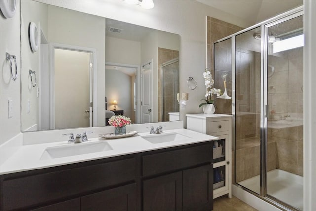 132 Sage Meadows Dr, San Marcos, TX 78666 - bathroom with a shower stall, double vanity, and connected bathroom