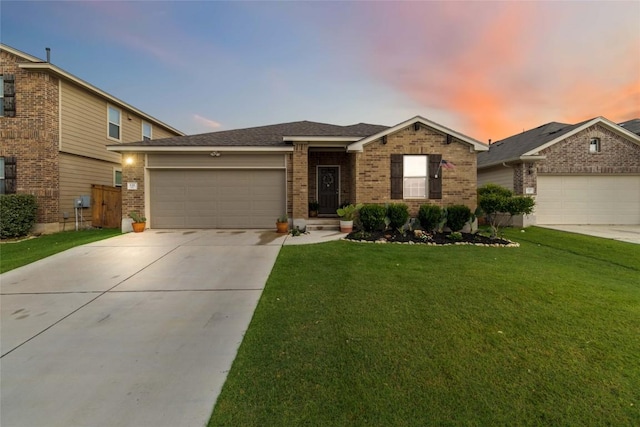 132 Sage Meadows Dr, San Marcos, TX 78666 - view of front of house with a garage, brick siding, driveway, and a front lawn