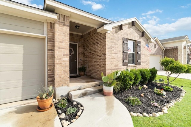 132 Sage Meadows Dr, San Marcos, TX 78666 - doorway to property featuring brick siding and a garage
