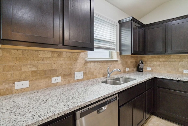 132 Sage Meadows Dr, San Marcos, TX 78666 - kitchen featuring stainless steel dishwasher, dark brown cabinetry, tasteful backsplash, and vaulted ceiling