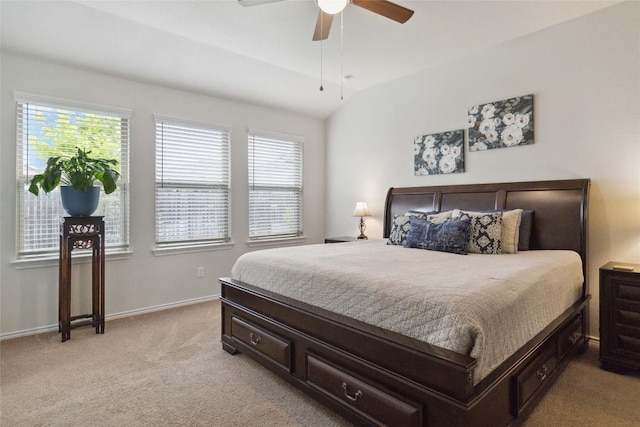 132 Sage Meadows Dr, San Marcos, TX 78666 - bedroom featuring light colored carpet, multiple windows, a ceiling fan, and vaulted ceiling