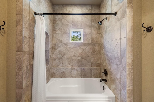 306 Anns Way, Blanco, TX 78606 - full bathroom with shower / tub combo and a textured wall