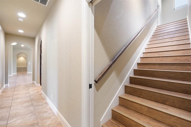 306 Anns Way, Blanco, TX 78606 - stairs featuring arched walkways, tile patterned flooring, and recessed lighting