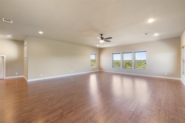 306 Anns Way, Blanco, TX 78606 - empty room featuring a ceiling fan, hardwood / wood-style flooring, and recessed lighting