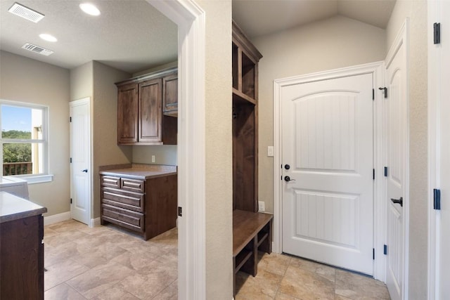 306 Anns Way, Blanco, TX 78606 - mudroom featuring recessed lighting and light stone finish floors