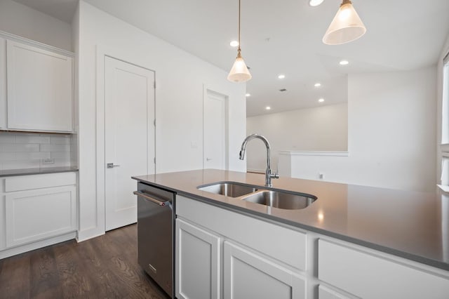 2050 Lohmans Spur Rd Unit 802, Lakeway, TX 78734 - kitchen with dark wood-style flooring, stainless steel dishwasher, white cabinetry, tasteful backsplash, and hanging light fixtures