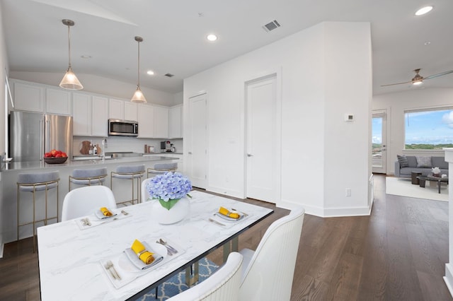 2050 Lohmans Spur Rd Unit 802, Lakeway, TX 78734 - dining space featuring vaulted ceiling, dark wood-style floors, recessed lighting, and ceiling fan