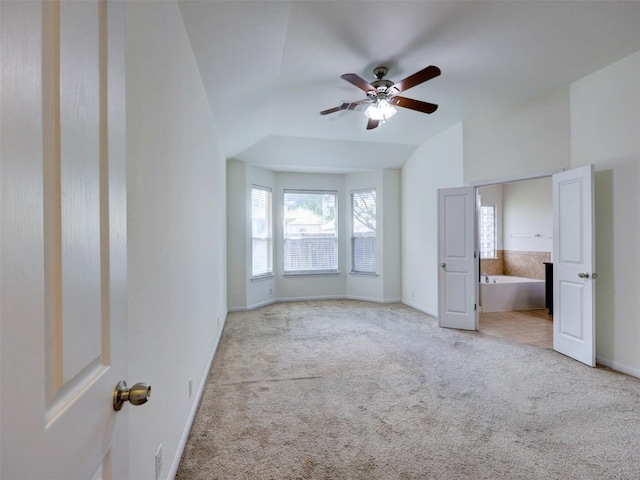 11600 Yeadon Way, Austin, TX 78717 - unfurnished bedroom with carpet, lofted ceiling, ensuite bathroom, and ceiling fan
