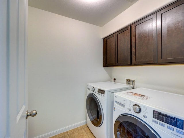 11600 Yeadon Way, Austin, TX 78717 - laundry room featuring cabinet space, washer and dryer, and light tile patterned flooring