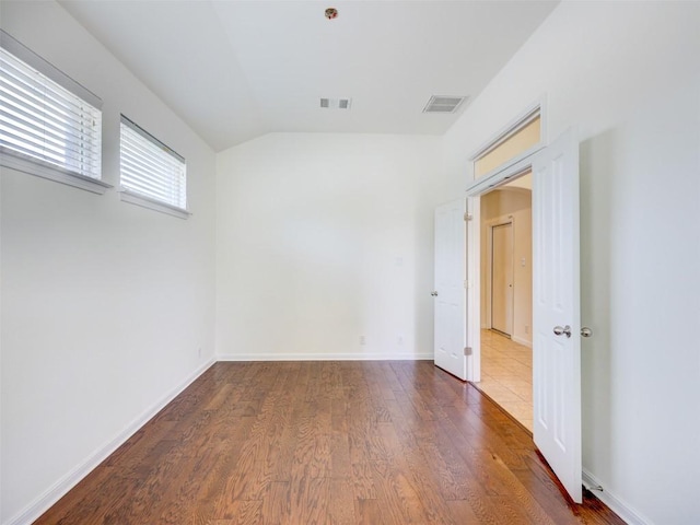11600 Yeadon Way, Austin, TX 78717 - spare room with wood finished floors and vaulted ceiling