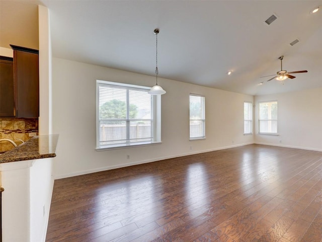 11600 Yeadon Way, Austin, TX 78717 - unfurnished living room featuring ceiling fan, wood finished floors, lofted ceiling, and recessed lighting