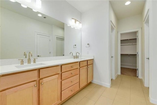 6800 Menchaca Rd Unit 45, Austin, TX 78745 - bathroom with double vanity, tile patterned flooring, recessed lighting, and a walk in closet