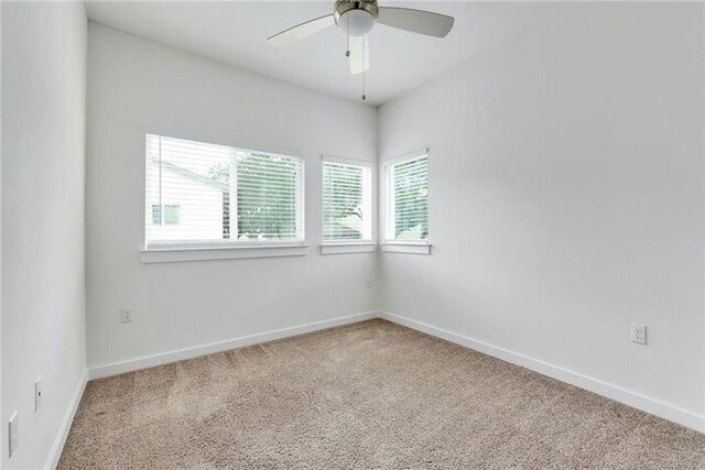 6800 Menchaca Rd Unit 45, Austin, TX 78745 - spare room with light carpet and ceiling fan