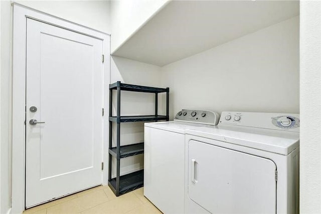 6800 Menchaca Rd Unit 45, Austin, TX 78745 - washroom with independent washer and dryer and light tile patterned flooring