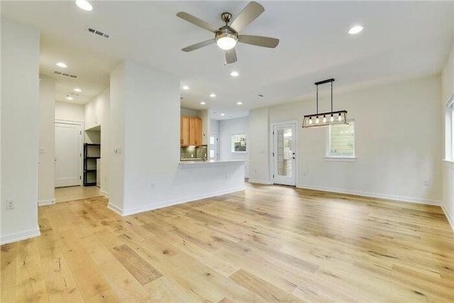 6800 Menchaca Rd Unit 45, Austin, TX 78745 - unfurnished living room featuring ceiling fan, light wood-style flooring, and recessed lighting