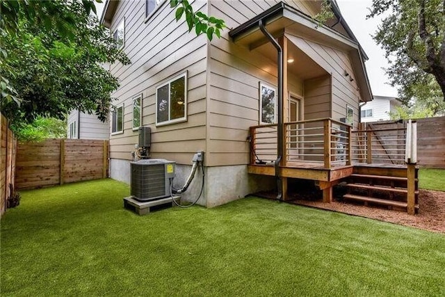 6800 Menchaca Rd Unit 45, Austin, TX 78745 - rear view of property with a fenced backyard and a deck